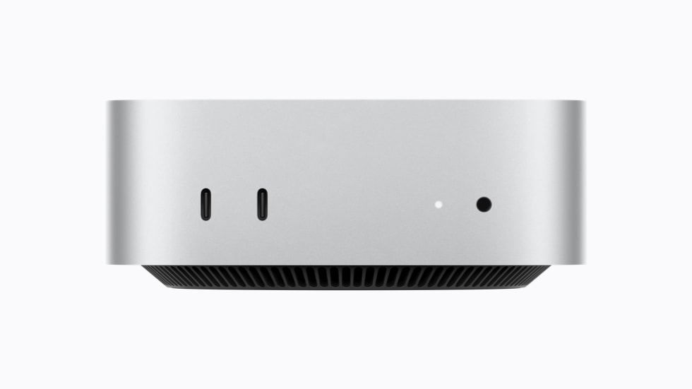 Mac mini 的正面视图,展示 2 个支持 USB 3 的 USB-C 端口和一个耳机插孔。